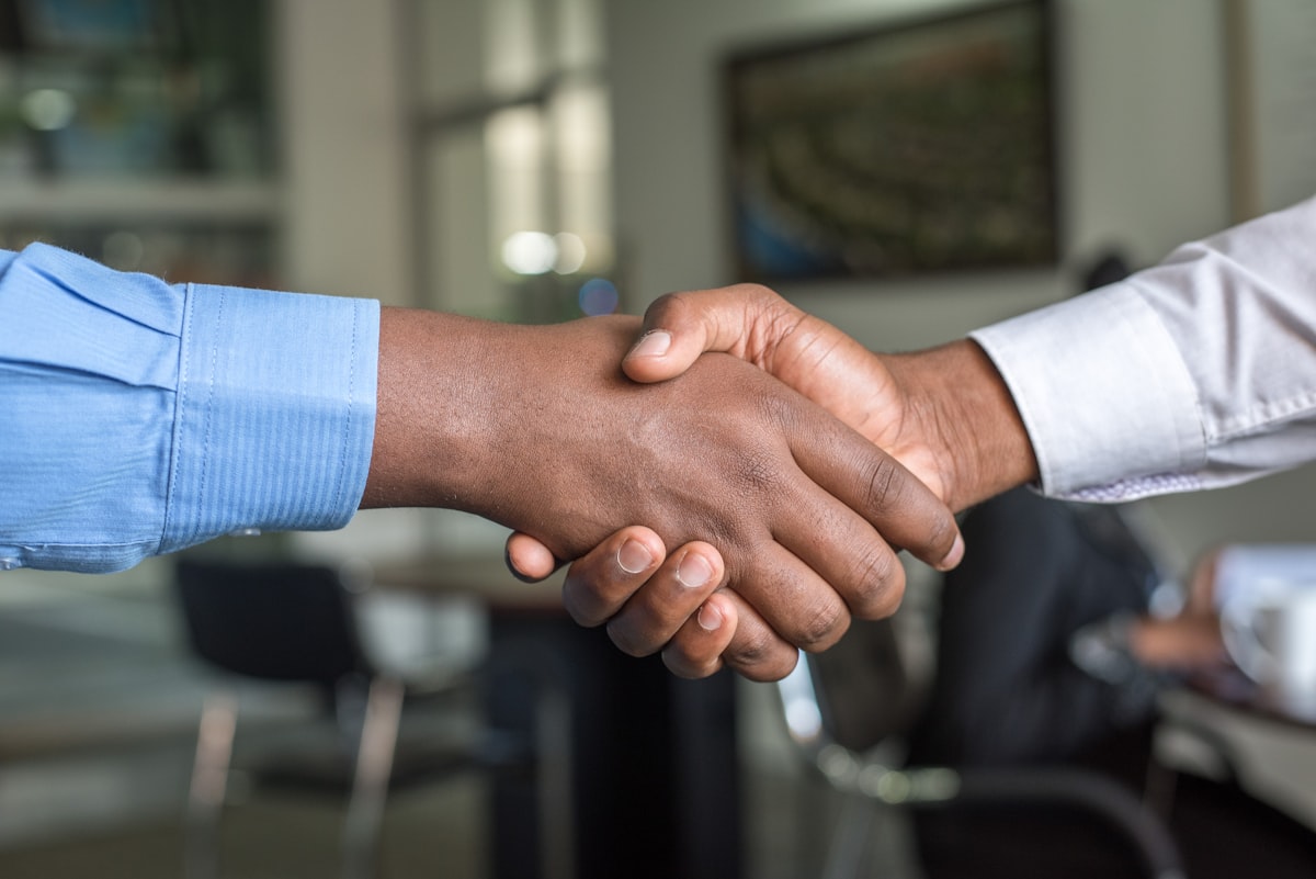 Professional handshake choosing a lawyer
